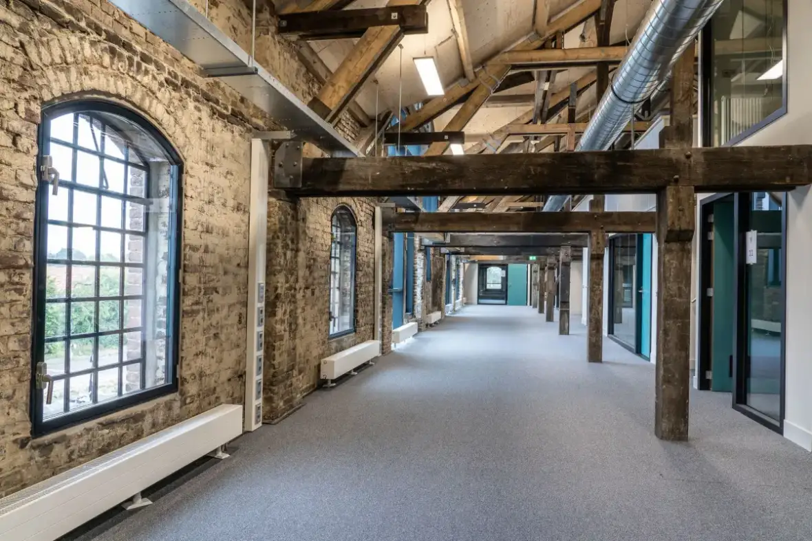 Commercial corridor with drywall walls of the kind that take repeated cart traffic