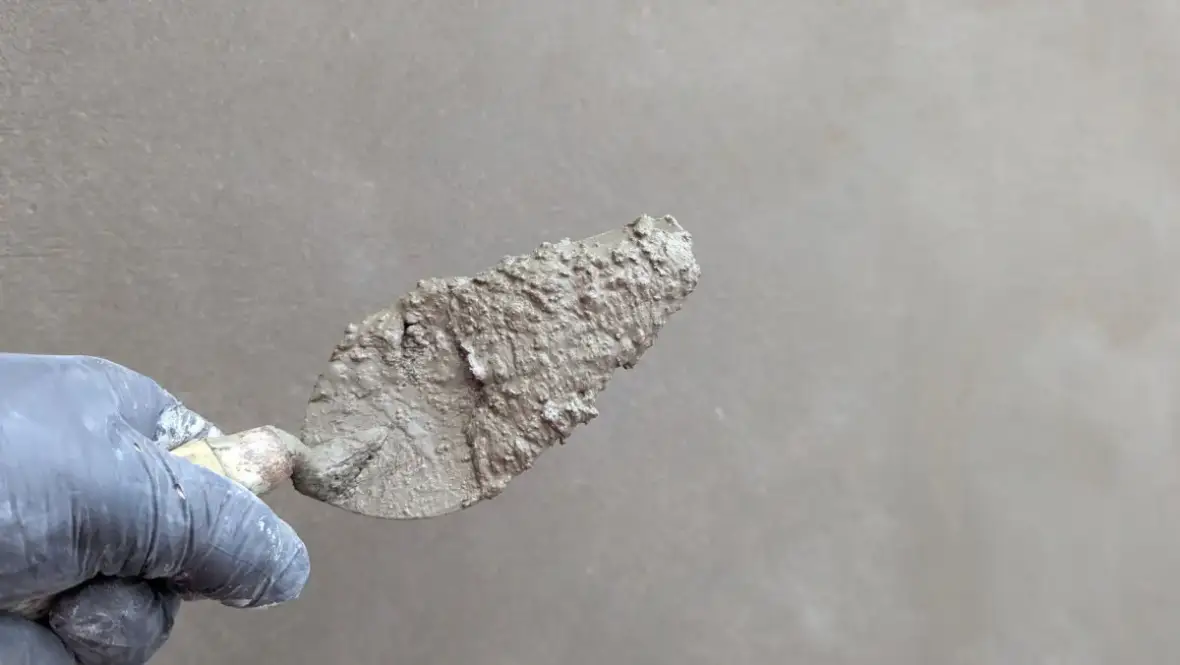 Plaster surface smoothed with a trowel during repair