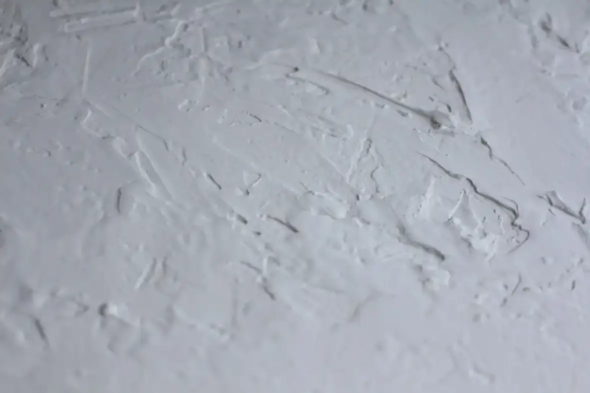 Popcorn textured ceiling surface before removal begins