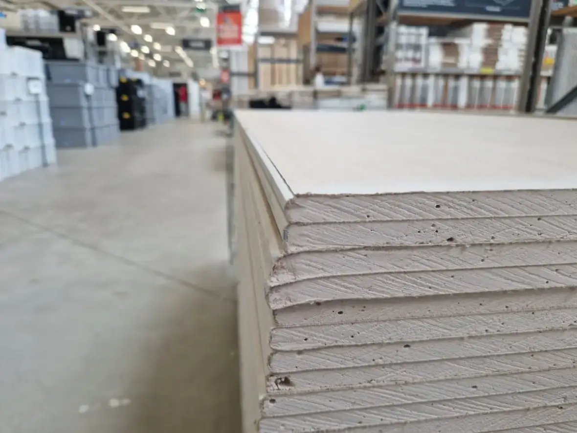 Drywall sheet edges showing the board type used in commercial partition construction