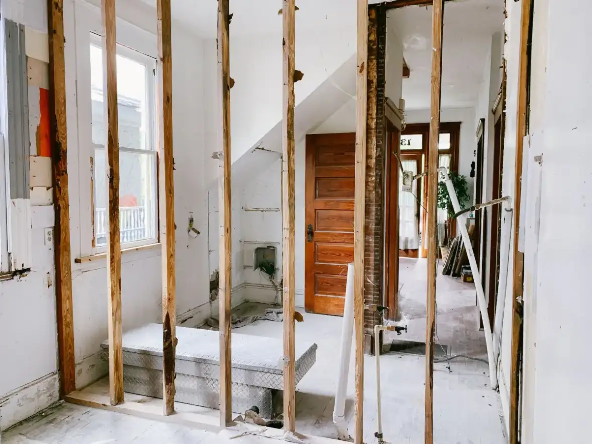 Framing left exposed so the cavity can dry before new board is installed
